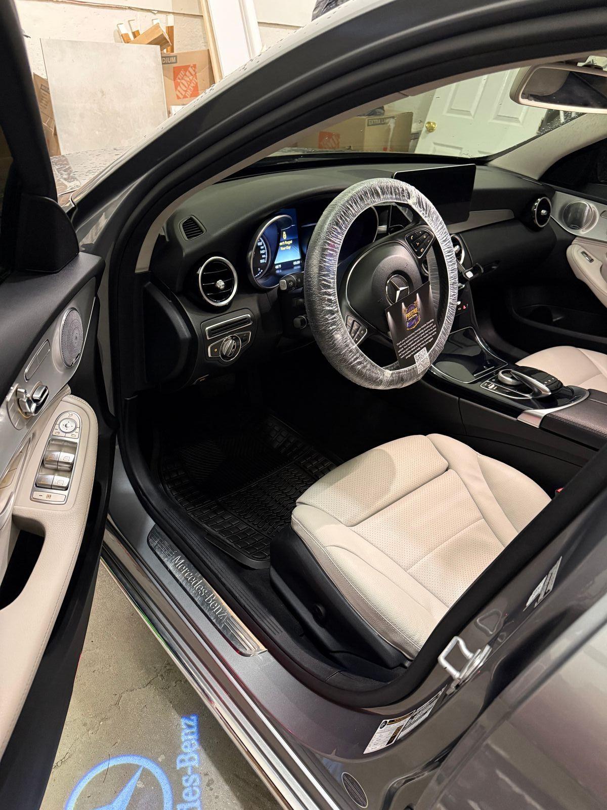 Mercedes-Benz front interior with white seats detailed