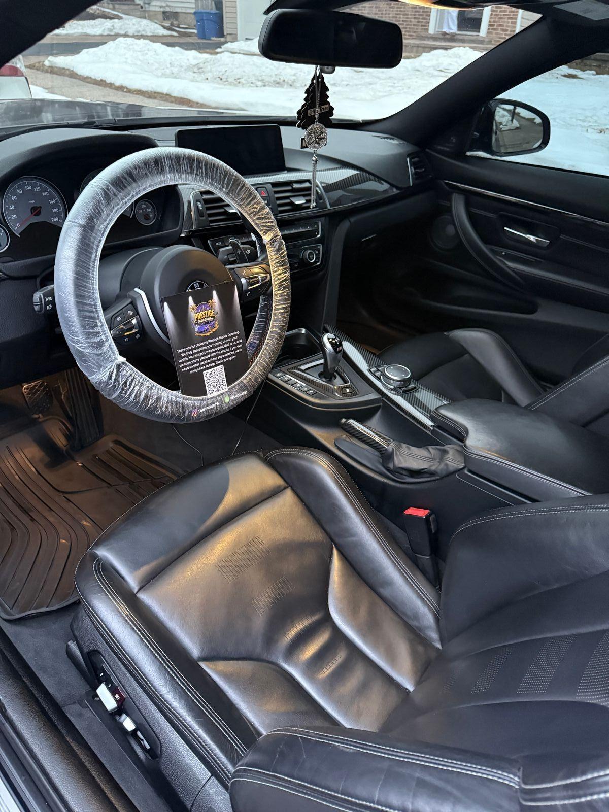 BMW M4 interior, dash and steering wheel detailed