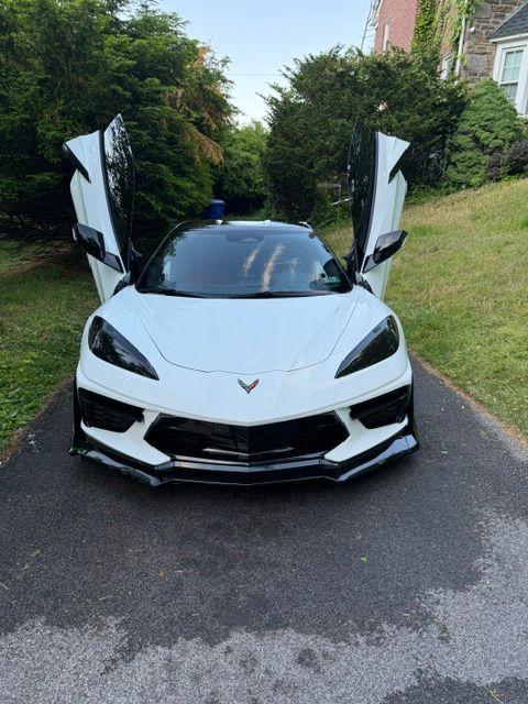 White Chevrolet Corvette with doors up after a full detail
